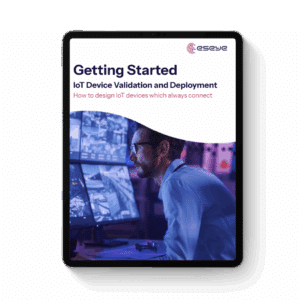 A tablet displaying a digital guide titled Getting Started: IoT Device Validation and Deployment with a subtitle, How to design IoT devices which always connect. The cover shows a man looking at multiple monitors.