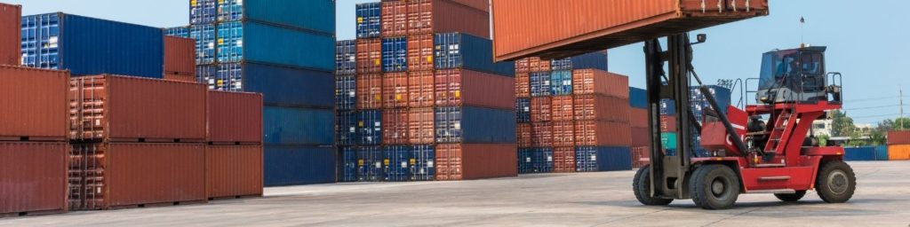 Forklift managing a container 